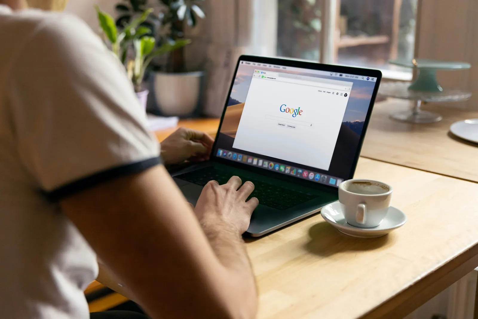 Tradesperson searching Google on a laptop