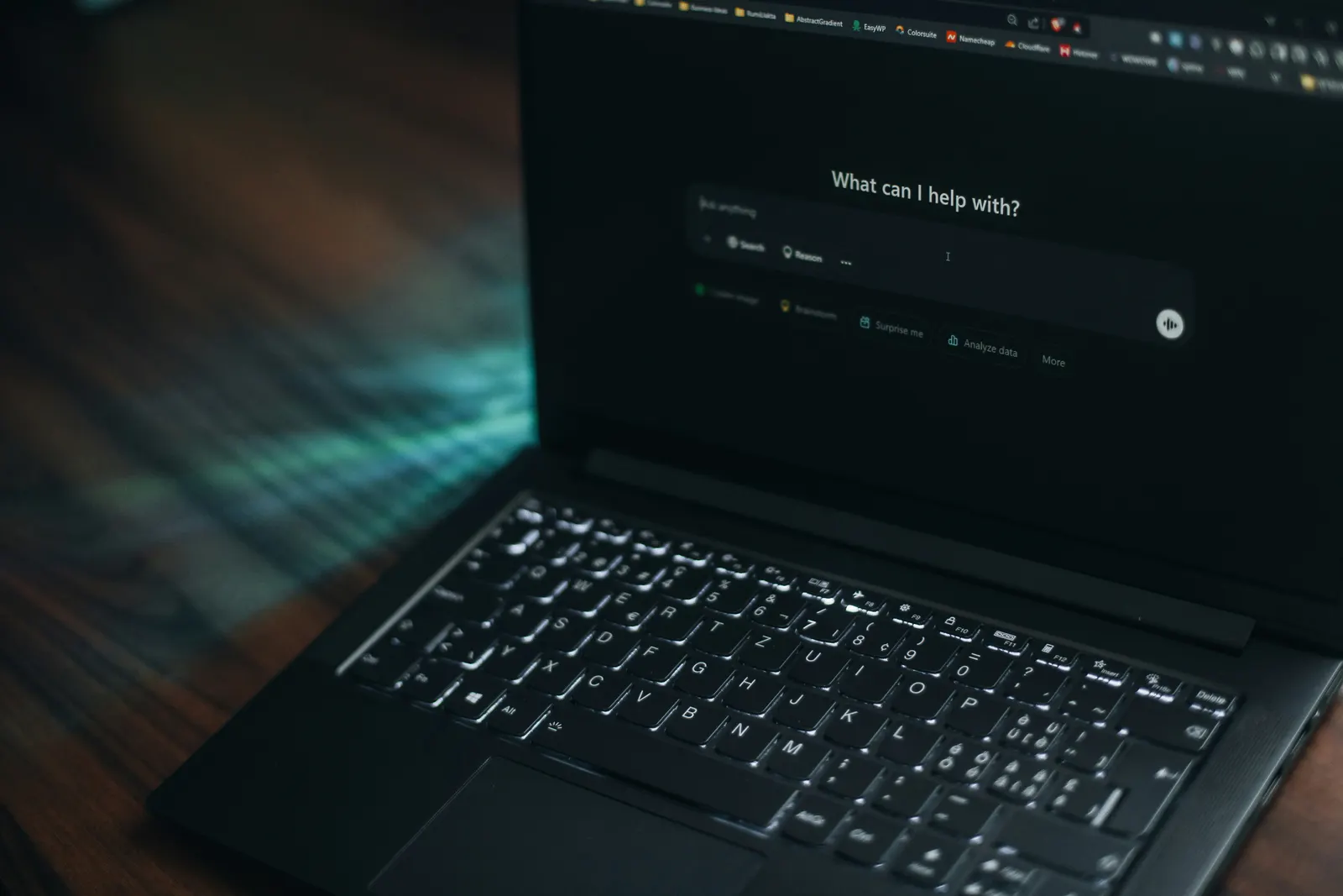 Laptop showing a search page in a dark room